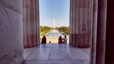 A photograph from the inside of the Lincoln Memorial looking out at the Washington Monument in Washington, DC, USA.