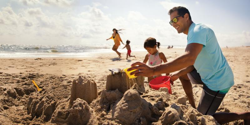 A family playing on the beach