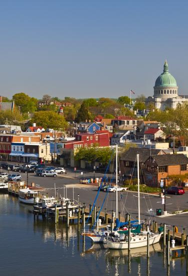 Ships and the top of Maryland's state capital building in Annapolis, Maryland, USA