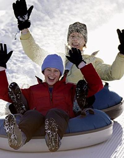 Two people with snowtubing at Wintergreen Resort in Virginia, USA